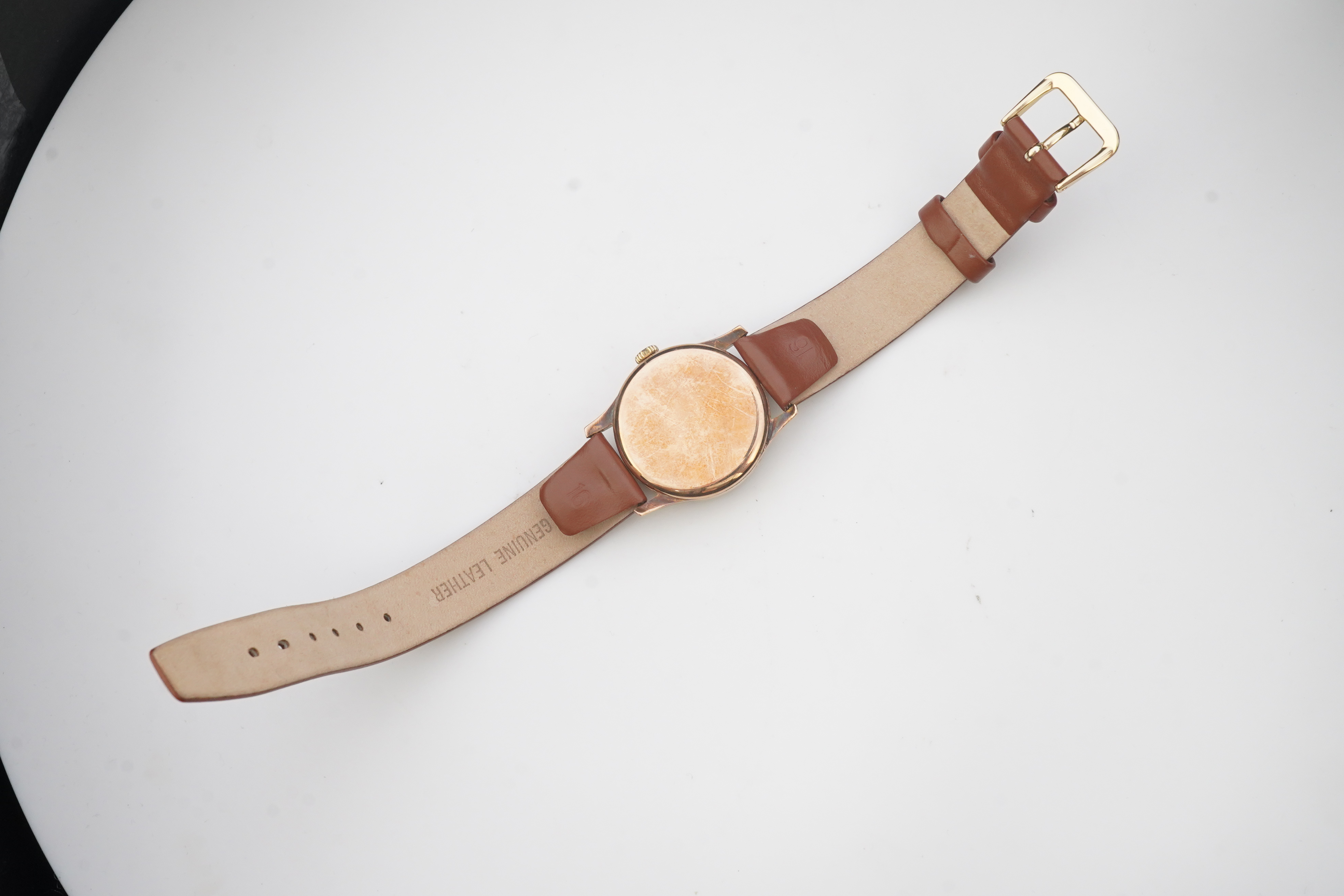 A gentleman's 1940's 9ct gold Omega manual wind wrist watch, on a later associated leather strap